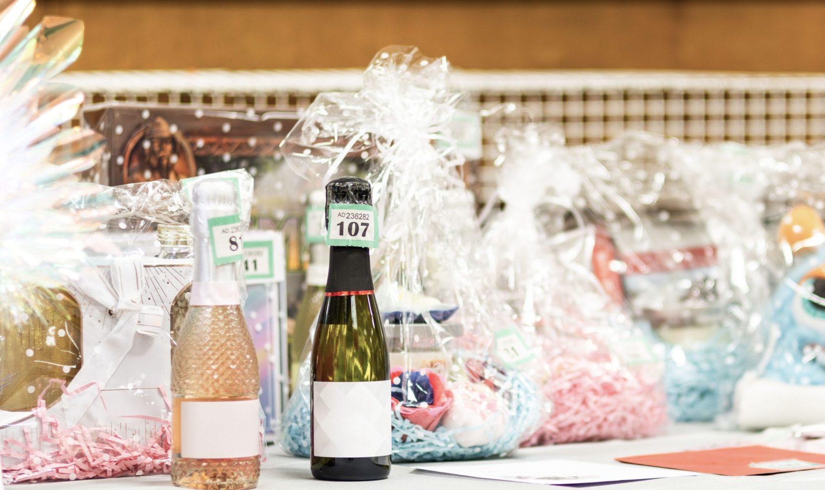 Selection,Of,Raffle,Prizes,And,Gift,Hampers,With,Sparkling,Wine